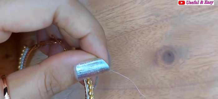 Red Hoop Earring (Circular Brick Stitch): Secure the end with knots and trim the thread.