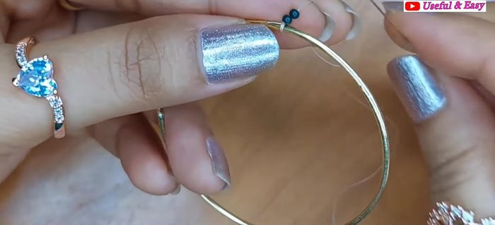 Green Ombre Hoop Earring (Herringbone Stitch): Add the fourth line with golden and parrot green beads using herringbone stitch.