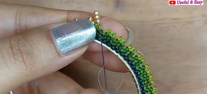 Green Ombre Hoop Earring (Herringbone Stitch): Secure the end with knots and trim the thread.
