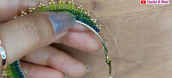 Green Ombre Hoop Earring (Herringbone Stitch): Secure the end with knots and trim the thread.