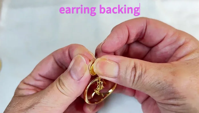 Attach the earring backing.