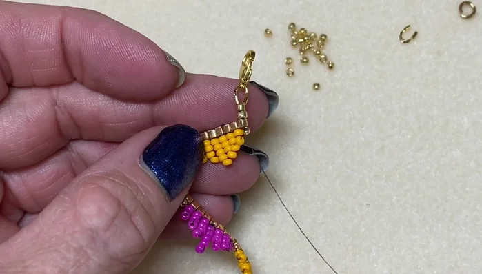 Finish: Secure all ends by weaving the thread through several beads, then trim the excess thread.