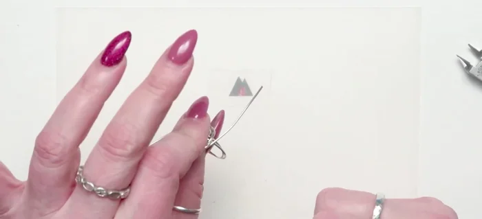 Final Shaping: Using chain nose pliers, make a few tight wraps on one side, securing the row. Use a ring vise to easily and tightly wrap the other side for a clean finish.