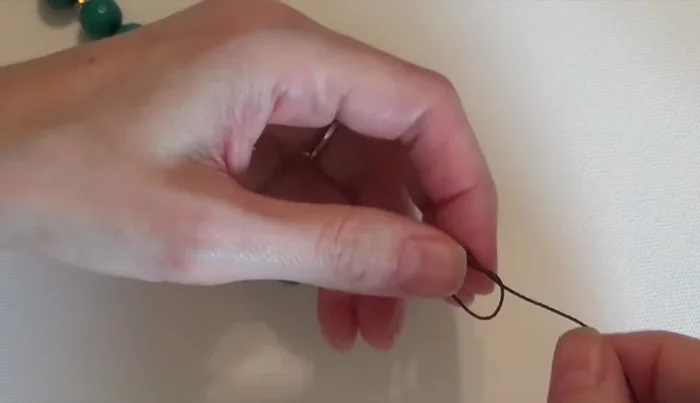 Add the final spacer bead and tie a knot.