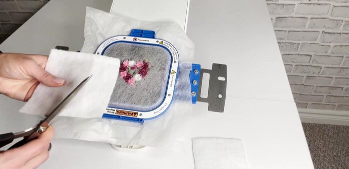 Spray adhesive on the last black felt piece and cover the batting completely.