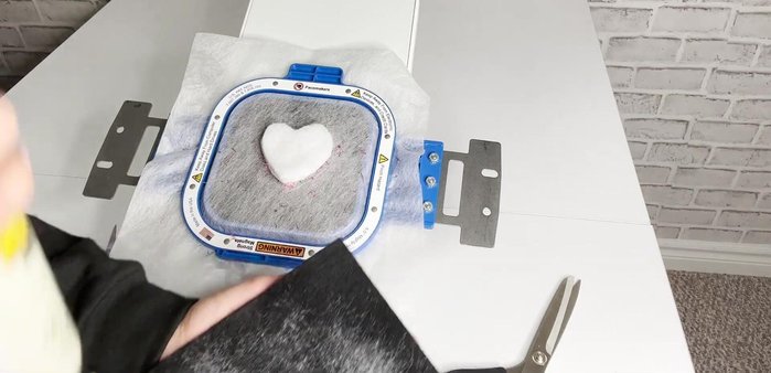 Spray adhesive on the last black felt piece and cover the batting completely.