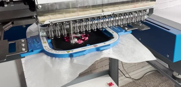 Unhoop, tear away stabilizer, and trim 0.25 inches from the stitch border.