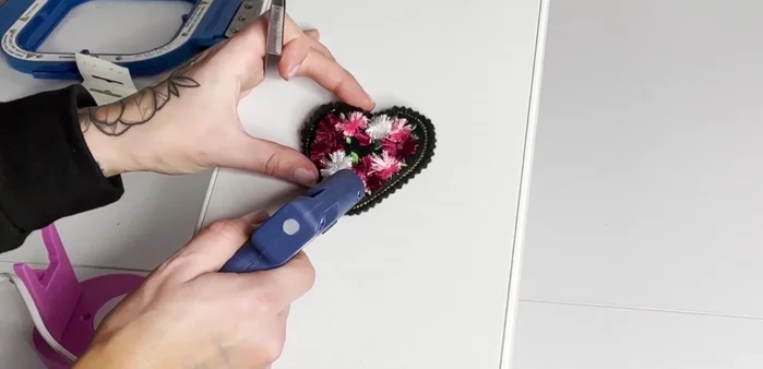 Attach the bar pin to the back using glue or sewing.