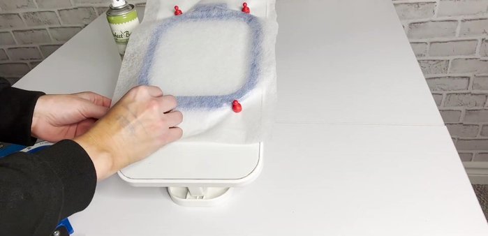 Spray adhesive on the back of one black felt piece and adhere it to the stabilizer.