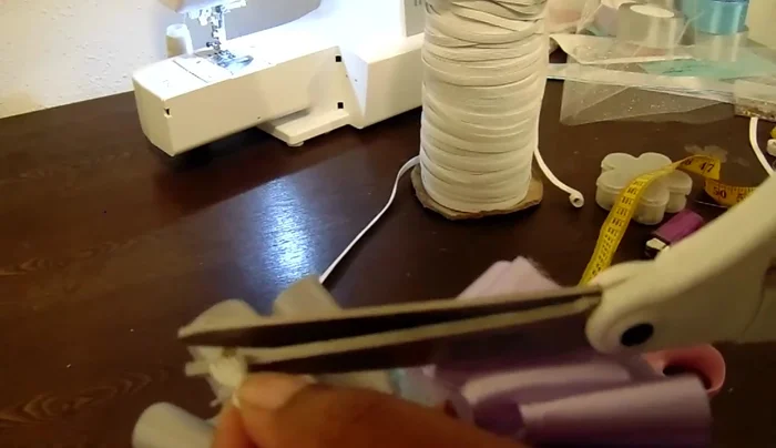 Hide the knot and adjust ruffles: Tuck the knot and excess elastic into the tulle casing and adjust the ruffles to evenly distribute them around the anklet.