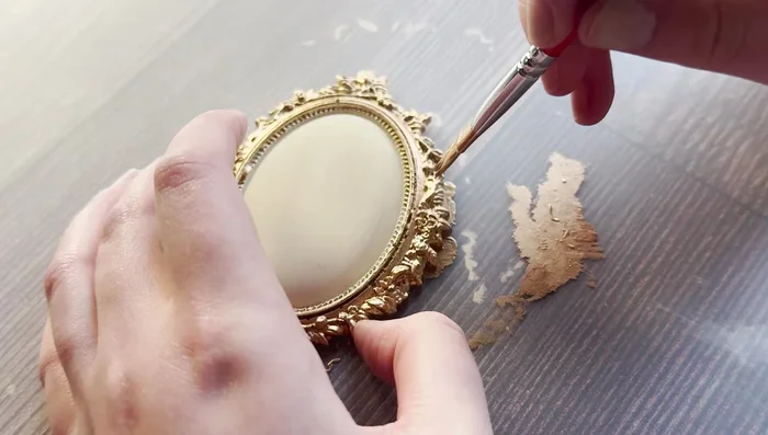 Optional: Seal the interior of the brooch before applying the transfer to improve adhesion.