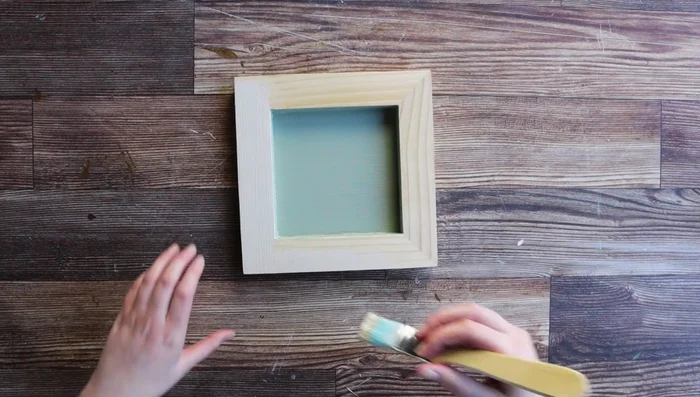 Add aging effects by using custom-mixed IOD inks and applying the Vintage Texture stamp to the shadow box edges.